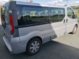 a silver van that is parked on the side of the road