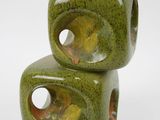 two green ceramic cubes stacked on top of each other