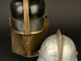 two helmets sitting next to each other on a table