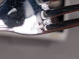 a close up of a fork and knife on a table