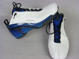 pair of white and blue shoes with black laces on them