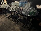 a lot of empty wine glasses sitting on a table