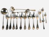 a lot of silver spoons and spoon spoons on a table