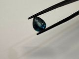 a pair of tonges with a blue diamond on it