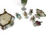 a lot of figurines that are sitting on a table