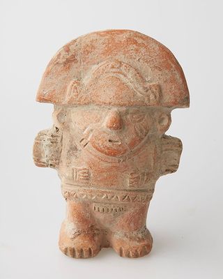 an image of a clay figurine of a man with a helmet on