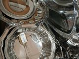 a lot of silver plates and pans on the table