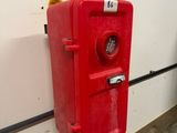 a red fire hydrant on the side of a wall