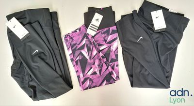 three pairs of women ' s nike leggings with tags on them