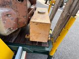 a small machine that is sitting on the side of the road