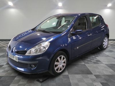 a picture of a blue car that is parked in a garage