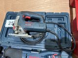 a corded jig saw in a blue case