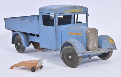 a blue toy truck with a wooden toy car next to it