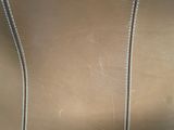 a close up view of a brown leather chair