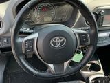 a steering wheel and dashboard of a car in a car showroom