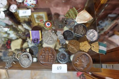 a glass display case with a lot of medals and medals on it