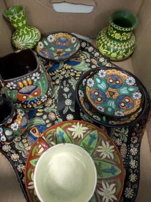 a box that has a table with plates and bowls on it
