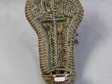 brass plated wall sconce with ornate design on a white background