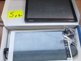 a tablet computer sitting on top of a box on a table