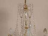a crystal chandelier hanging from a ceiling in a room