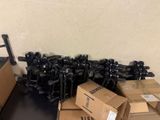 a pile of guns and boxes on the floor