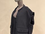 a mannequin dressed in a suit with a crown on it ' s head