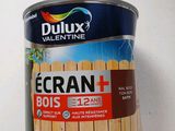 a can of paint on a table with a white background