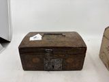 a small wooden box with a tag on it