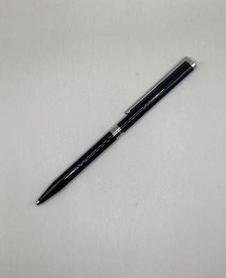 a picture of a black pen on a white surface