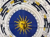 an image of a clock with a sun in the middle