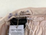 a label on the back of a jacket with a tag attached to it