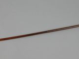 an image of a wooden stick on a white surface