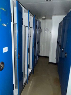 many blue lockers lined up in the hallway of a building