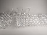 a lot of clear plastic beads on a white surface