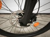 a close up view of a bicycle ' s front wheel