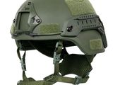 the helmet is green and has a small patch on the side of the helmet