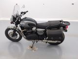 a black motorcycle that is parked in a room