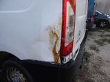 a white van that has rust on the back of it