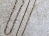 gold filled necklace with a chain on a white background