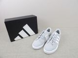 the adidas shoes are on the floor next to a box