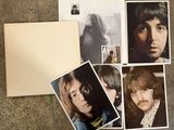 a lot of pictures of the beatles on the floor