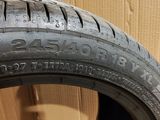 a close up of a tire with a box in the background