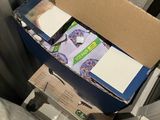 a cardboard box that has a bunch of items inside of it