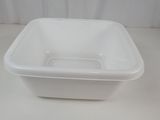 a white plastic container with a lid on a table
