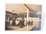 several men standing in a room with a table