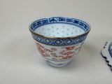 a blue and white bowl sitting next to a white plate
