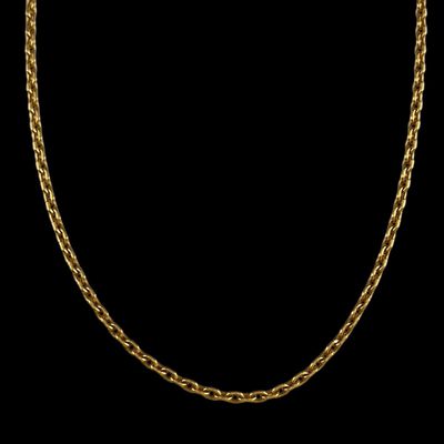 a gold necklace with a chain on a black background