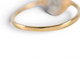 an image of a gold ring with a pearl in the middle