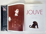 an open book with a picture of a man and a cat on it