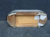 a small piece of wood with a piece of tape on top of it